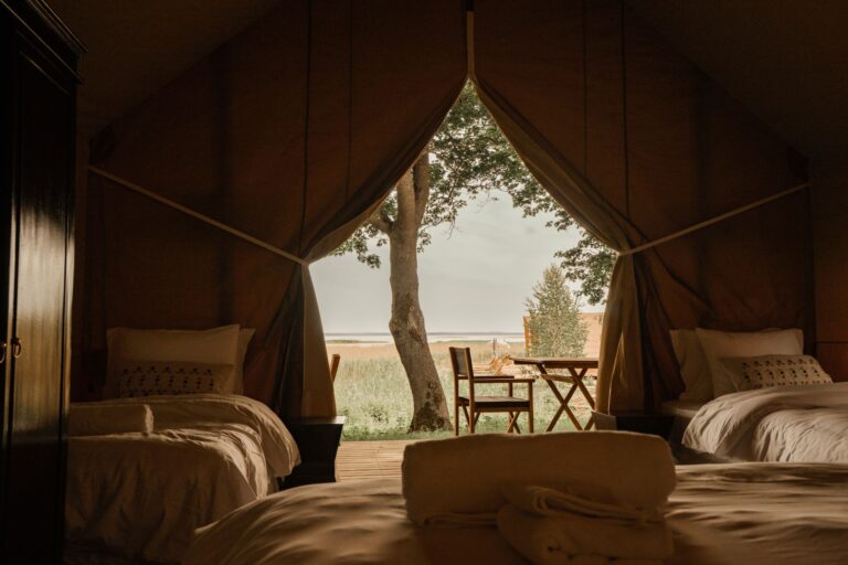 Glamping tent interior at Mia Glamping in Saaremaa showing full layout from entrance to terrace