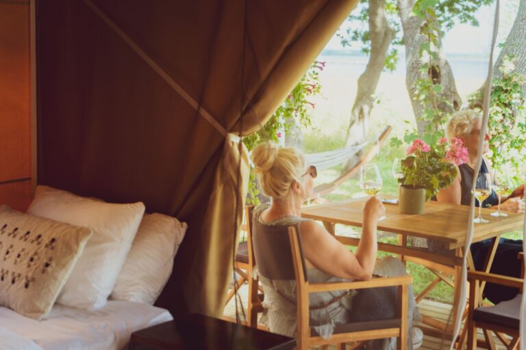 Glamping tent terrace at Mia Glamping in Saaremaa with guest relaxing at table